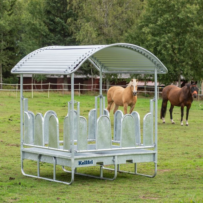 Feeder with roof and covered tombstone railings for horses